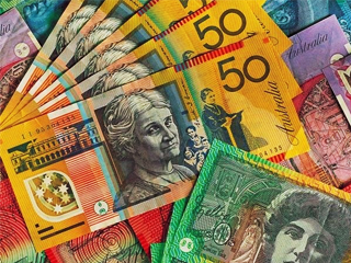 Australian Dollar consolidates around a major level after trimming intraday gains